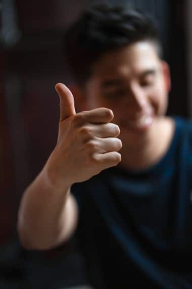 A man with a thumbs up