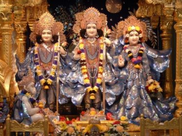 Idols of Sita (far right), Rama (center), Lakshmana (far left) and Hanuman (below, seated) at Bhaktivedanta Manor, Watford, England