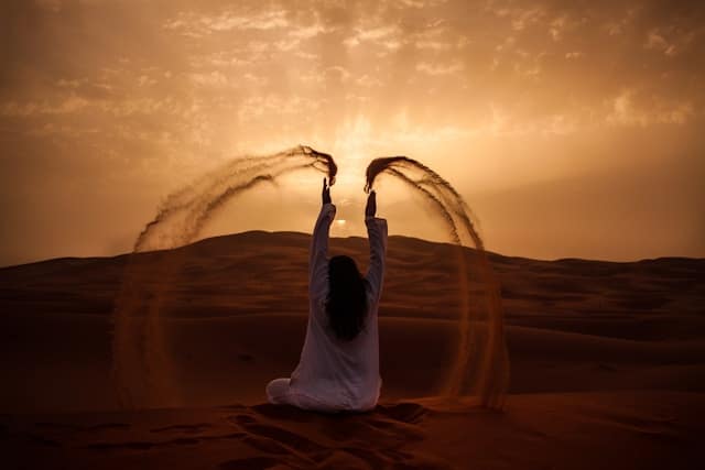 Woman sitting on a desert