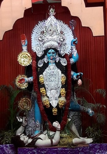 The goddess is generally worshipped as Dakshina Kali (with her right feet on Shiva) in Bengal during Kali Puja.