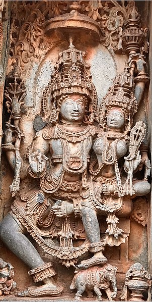 12th-century Vedic Indra and Indrani at Shaivism Hindu temple Hoysaleswara arts Halebidu Karnataka India